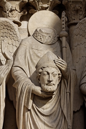 Sculpture at Notre Dame of Saint Denis holding his head